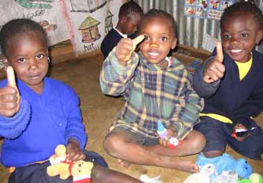 FKC children giving a thumbs up